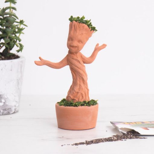 Dancing Groot Chia Pet from Guardians of the Galaxy Vol. 2. Each kit comes with a custom moulded Baby Groot pottery planter, convenient plastic drip tray, and enough chia seed packets for 3 plantings.